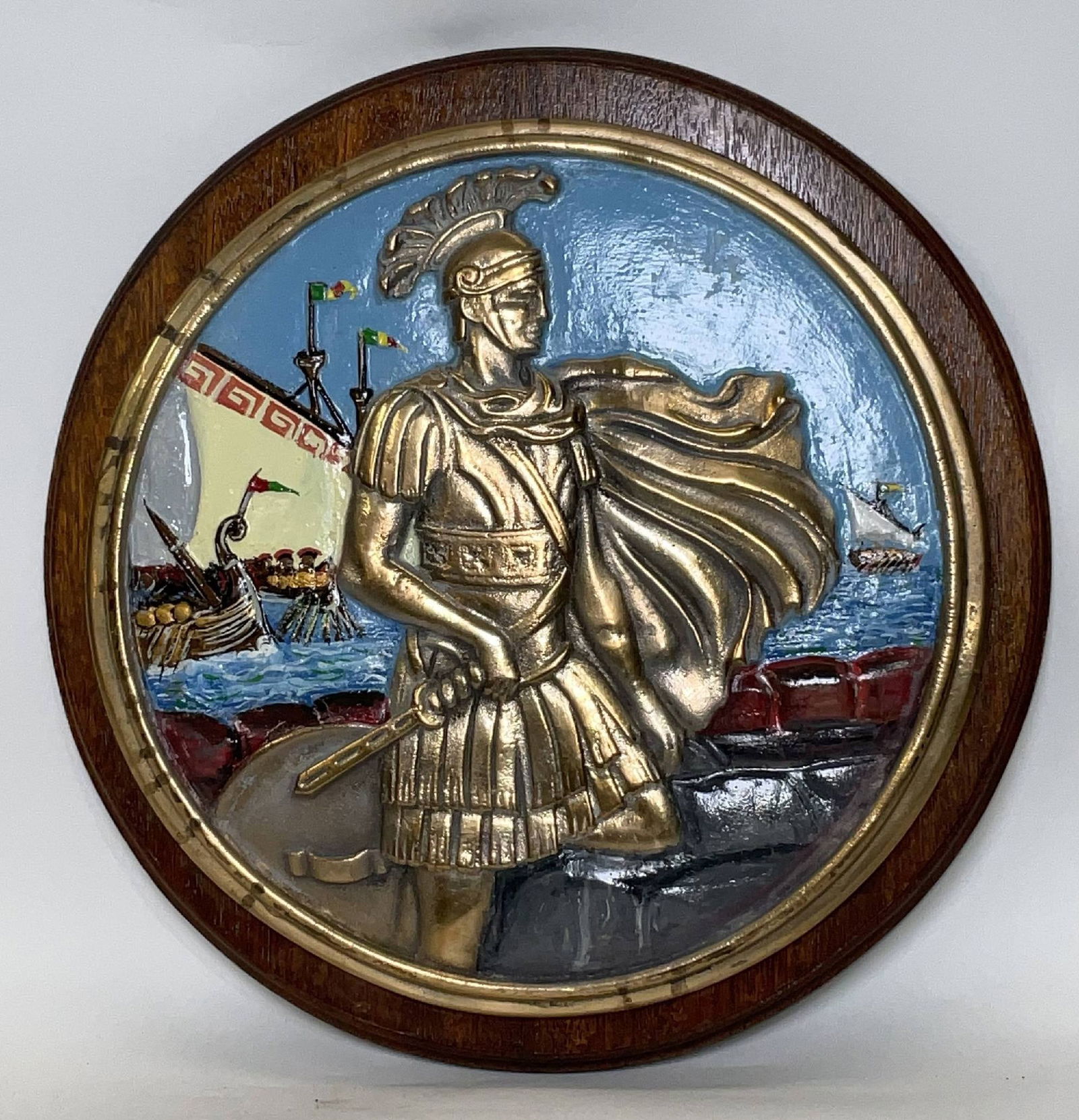 Ship’s Badge from Royal Navy Submarine HMS Conqueror: Solid brass ships badge from HMS Conqueror, a nuclear sub from the British Royal Navy. HMS Conqueror sank the general belgrand during the falkland war. Mounted to a backboard. 25 lbs. 15"Diameter.