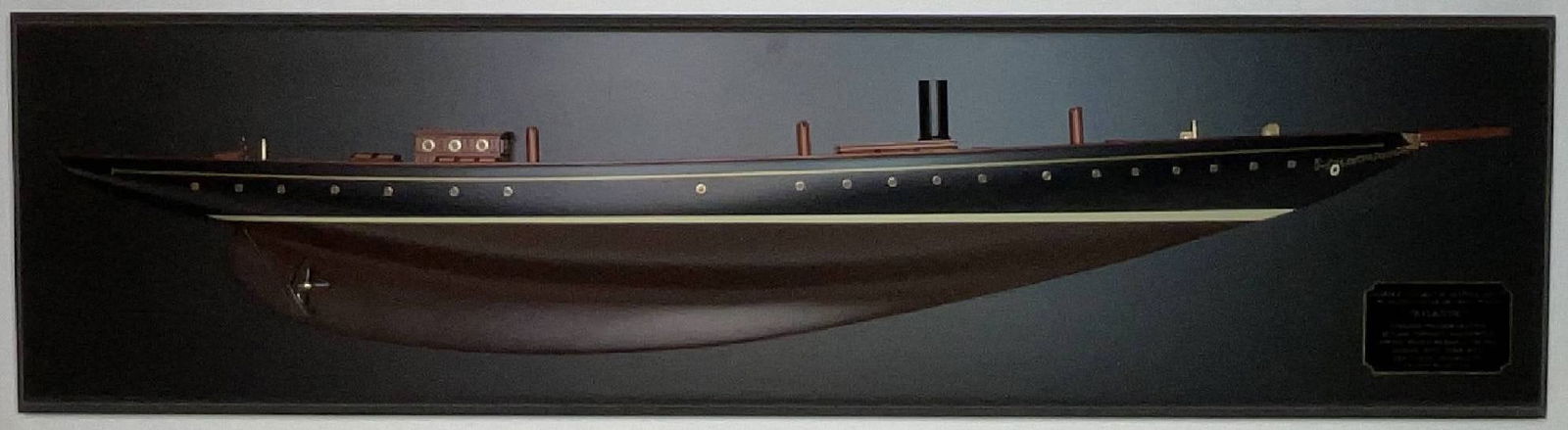 Half Model of the Schooner Yacht Atlantic: Carved half model of the Schooner Yacht Atlantic. Quality workmanship with a planked deck. Mahogany skylights with brass bars. Other details include stubbed masts, cleats, winch, portholes, etc.. A ve