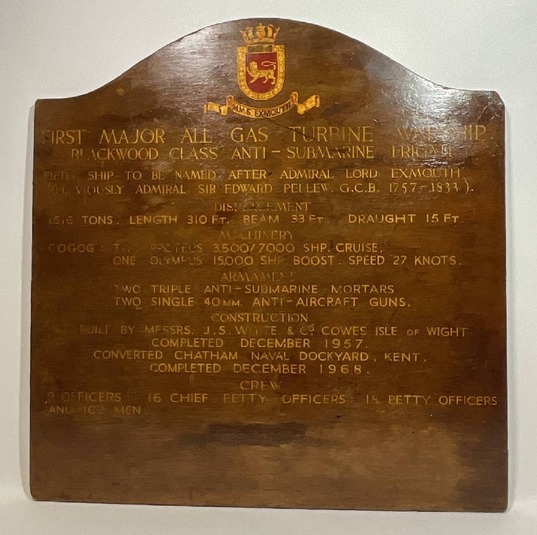 Nameboard HMS Exmouth: Ship’s nameboard from the Royal Navy warship HMS Exmouth (H02). She was an E-class destroyer flotilla leader, built for the Royal Navy in 1934. Weight: 9 lbs. Dimensions: 31" H x 30" W.