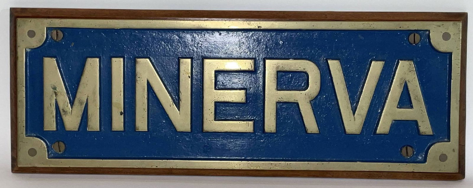 Royal Navy Ship's Nameboard from HMS Minerva: Heavy brass ship's nameboard from HMS Minerva, a Leander-class frigate of the Royal Navy. King Charles served aboard this ship in the 1970s. She measured 372 feet in length. 28 lbs. 10" H x 27" W.