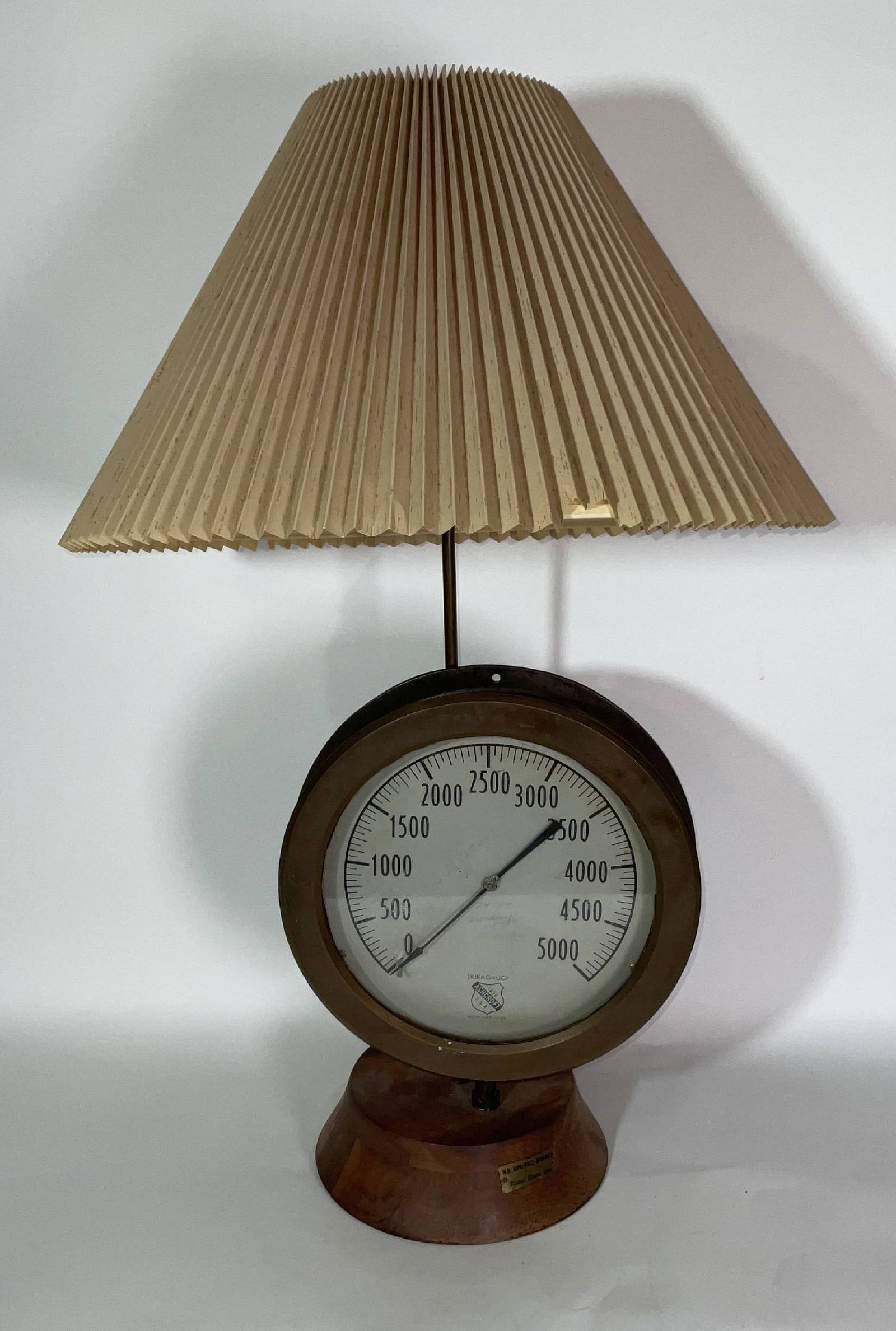 SS United States Steam Gauge: Scarce steam gauge from the SS United States ocean liner. Gauge is by Ashcroft U.S.A., the Duragauge model with brass SS United States Line plaque on the wood base. 18 lbs. 34"H.