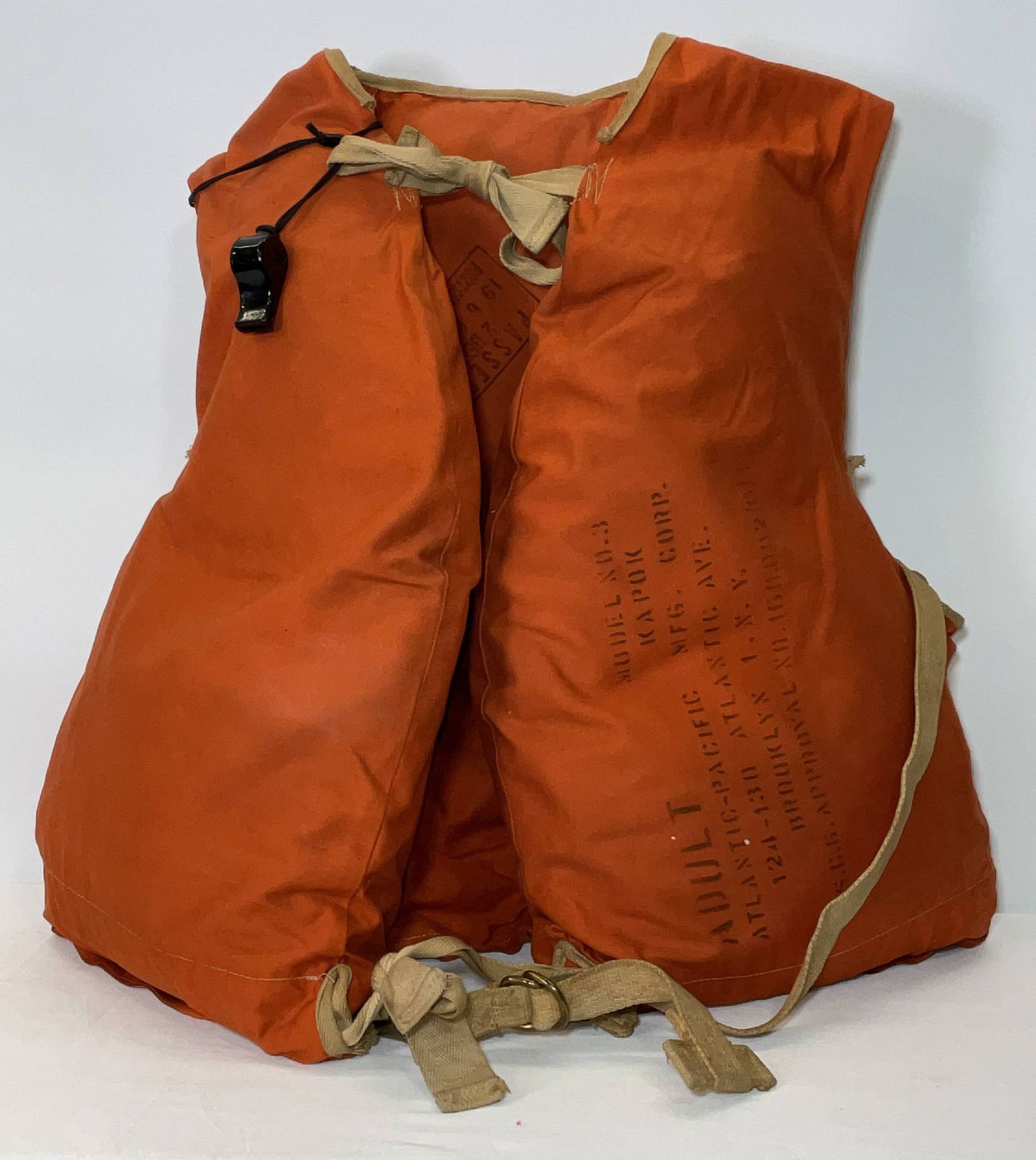 SS United States Orange Life Vest: Authentic life vest from the United States Lines "SS United States". With passed stamps dated 27 Dec 1960 Norfolk VA., marked "Atlantic Pacific MFG Corp. 124-130 Atlantic Ave Brooklyn NY." With USCG