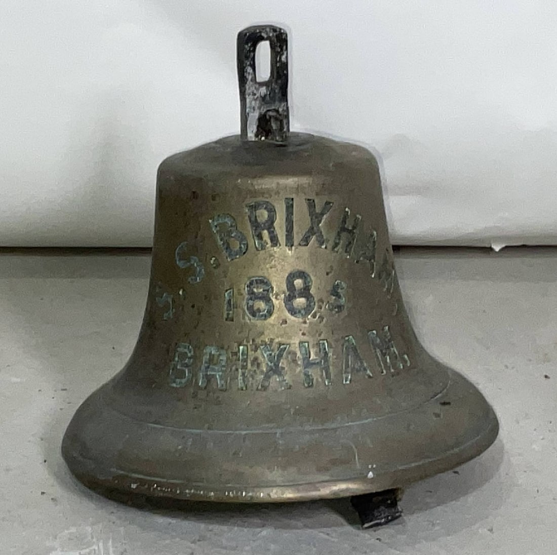 Brixham Iron Screw Steamship Ship's Bell from 1885: Ship's bell from the SS Brixham, a 183 foot steamer whose homeport was also Brixham. She later had owners in Perth Amboy, New Jersey and Boston. Bell is deeply engraved. 10"H x 10"W.
