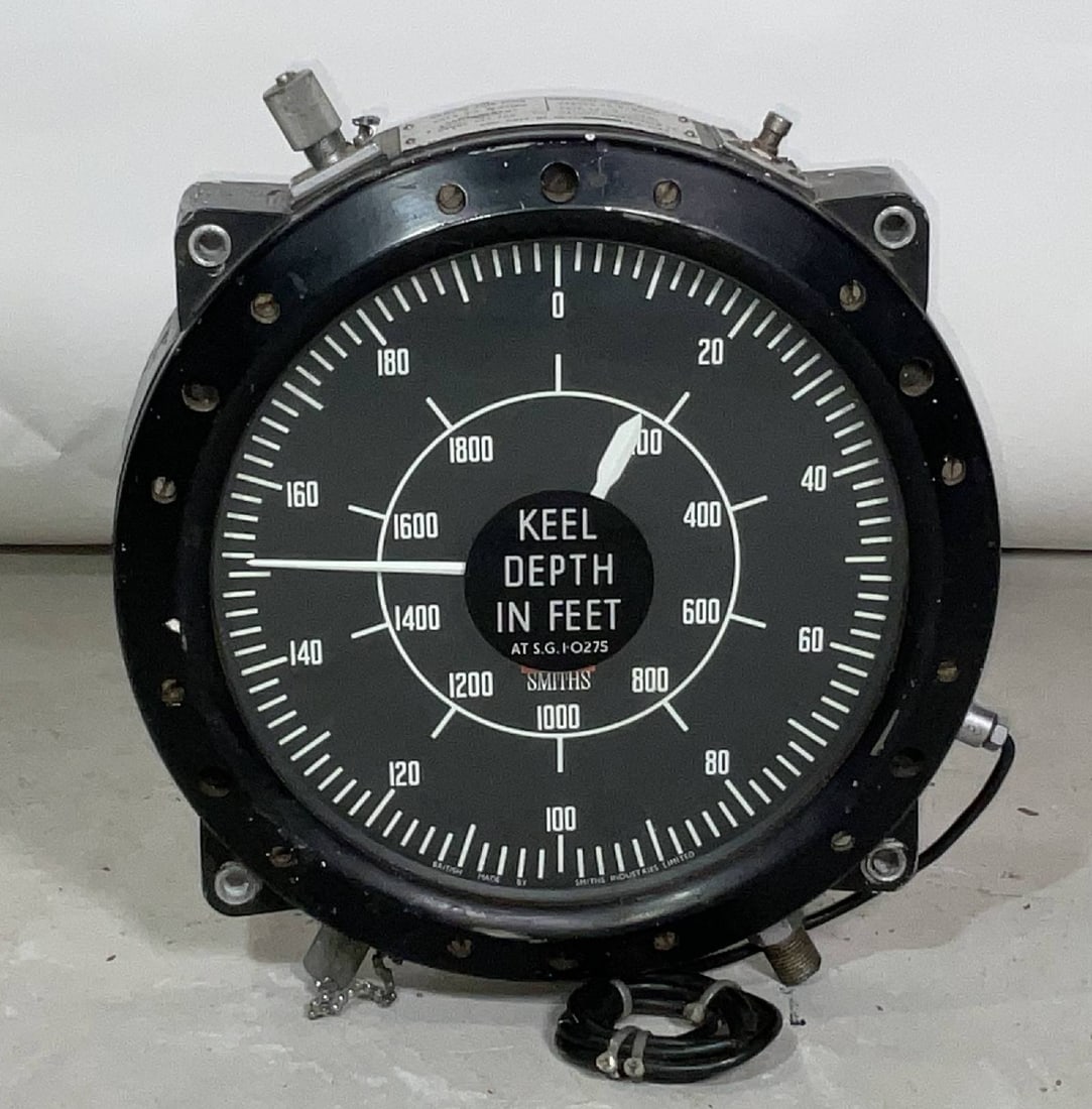 Submarine Keel Depth Meter by Smith Industries of England: Keel depth in feet gauge for a submarine by Smith Industries Limited of Britain. Black dial with painted white gauge. Measuring to 2000 feet. Dated 1970. With 1985 calibration sticker from HM