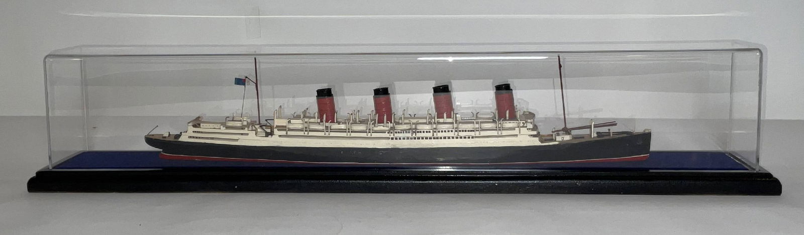 A Small Cased Waterline Model of Aquitania: RMS Aquitania was in service to Cunard from 1914 unti 1950. She was launched in 1913 and was the third of Cunard's "Grand Trio" that included Mauretania and Lusitania, as well as the last of the