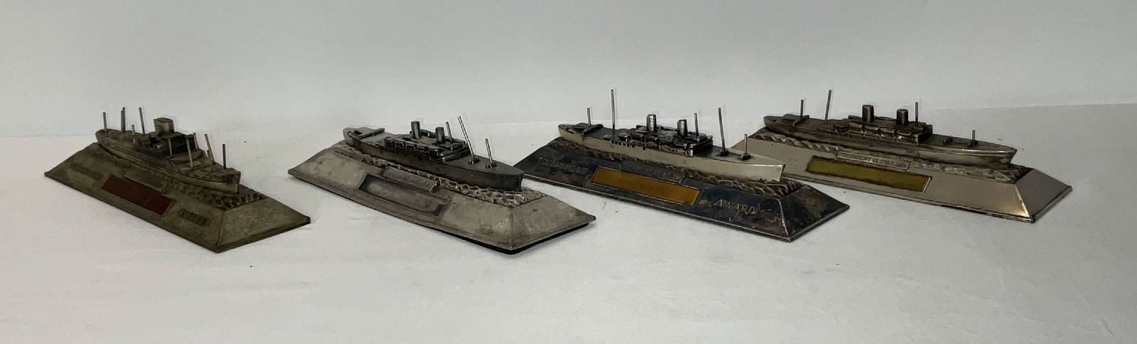 President Cleveland Metal Award Ships on Metal Bases: Four steamship models including SS President Cleveland, SS President Wilson, and President Polk shipboard contest trophies. 9 lbs. 2"H x 8"W x 3"D.