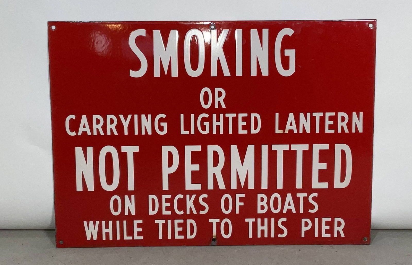 Porcelain No Smoking Sign: Red and white painted no smoking or lantern sign from a pier side. 9 lbs. 28"H x 20"W.