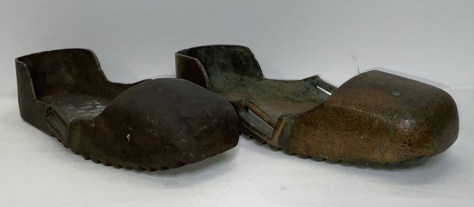 Solid Bronze Diving Shoes: Pair of solid diving shoes with strap brackets, raised back and treads.