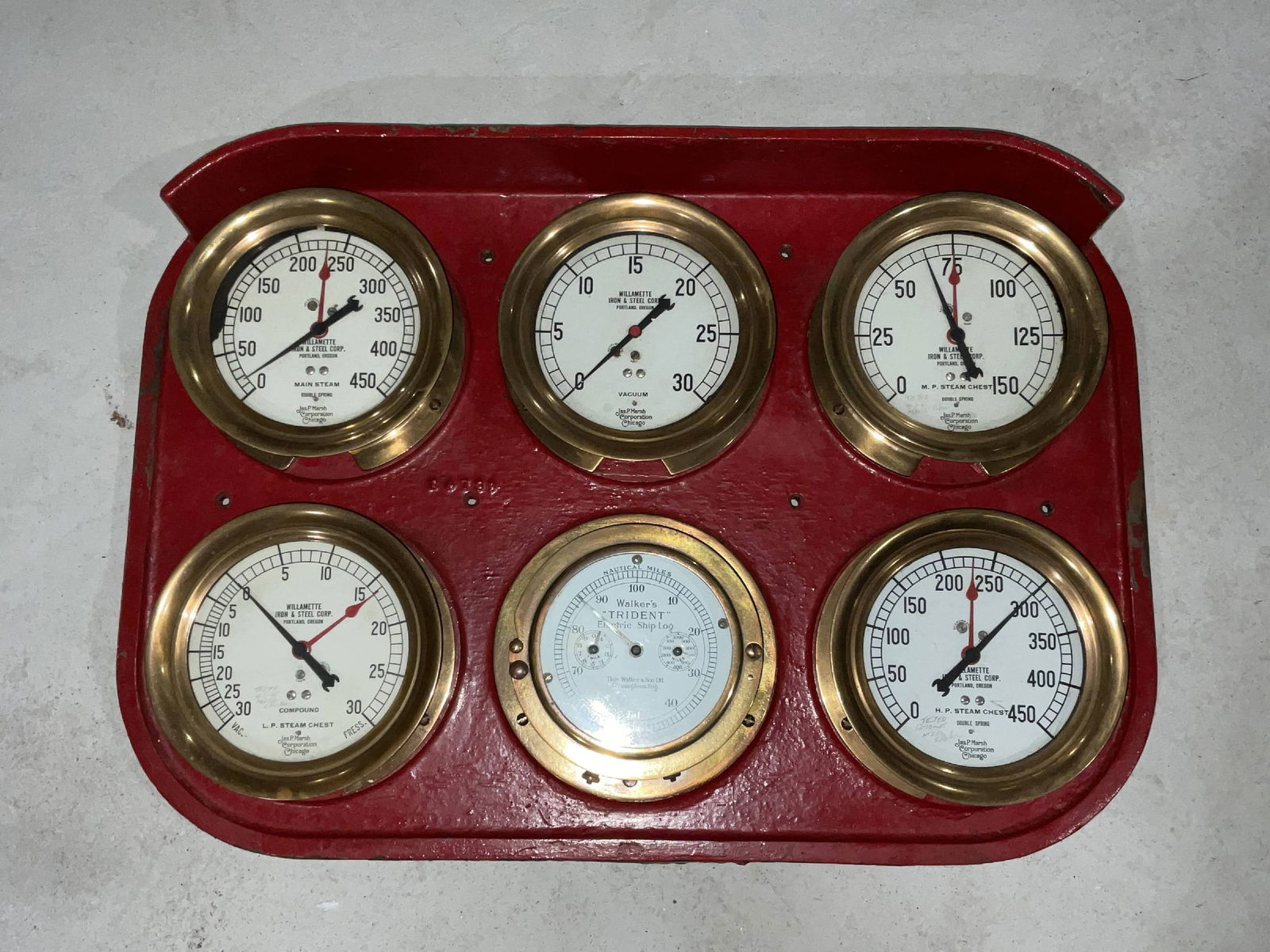 Ship's Engine Room Gauge Display on Iron: Iron plate fitted with six various gauges from James P. Marsh Corporation of Chicago and a Tridents ship's log. 27"H x 29"W.