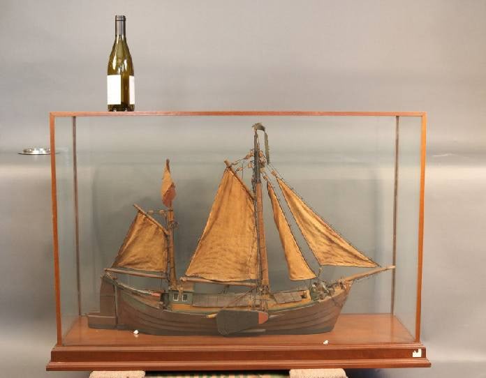 Cased Ship Model of a Dutch Work Boat: Early model from the late 19th-century of a Dutch work boat. Old world feel. Rigged with sails and fitted with lee boards. Fitted to a mahogany and glass case. 47" L x 14" W x 31" H