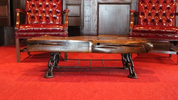 Coffee/cocktail table from Anthony's Pier 4: Coffee/cocktail table crafted from old ship’s timber and welded chain for legs. The top timber is 5” thick. 46” long x 21” x 14” high.