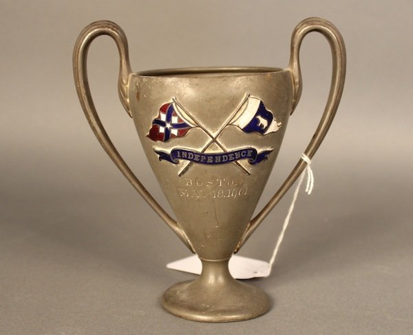 Thomas W. Lawson yacht “Independence” loving cup.: Pewter loving cup from the launching of the Thomas W. Lawson yacht “Independence”. With cloisonne` burgees of the Hull Yacht Club and Thomas W. Lawson’s private yacht flag, along with a flowing 