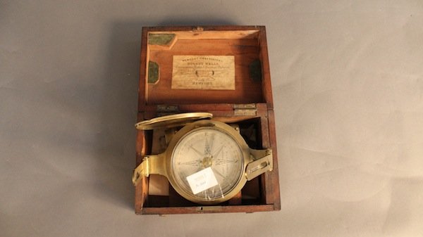 Rare, 19th century compass: Rare, 19th century surveyors compass with label from the workshop of Nugent Wells, chronometer maker and practical optician, jeweler, silversmith and chart seller. 22 High St. Newport From the collect