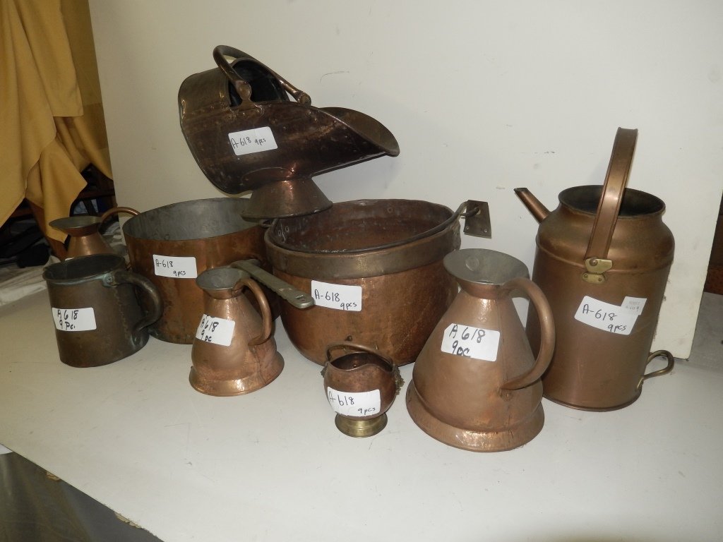 Nine copper pots and pitchers as a lot: Nine various copper pots and vessels including large heavy copper pots, pitchers and other vessels including a coal hod.