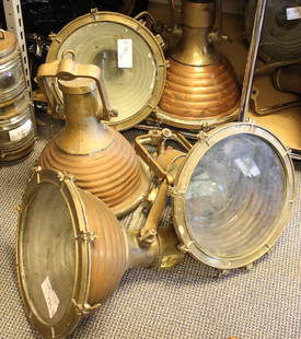 Five copper funnel spotlights: Five copper and brass ship’s cargo fox lights with brass yoke and rippled copper housing. Diameter is 15”