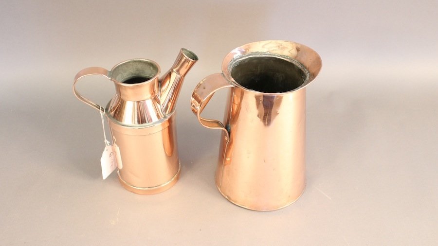 Pair of Solid Copper Pots: A solid copper pitcher with wide spout and handle. The second has an elongated spout and enforced bottom. 10 x 9.