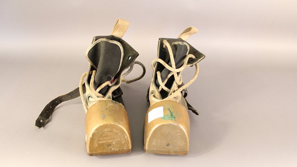 Deep Sea Diving Shoes: Brass and canvas deep sea diving boots with toecaps engraved 'Diving Equipment Supply Co., Inc. Desco, Milwaukee Wis, Pat applied for'. Boots have rope laces, brass eyelets, etc.
