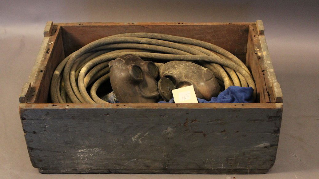 Three Air Masks with Hose: Three glass-eyed air masks with regulators in a timber box with long length of air hose.