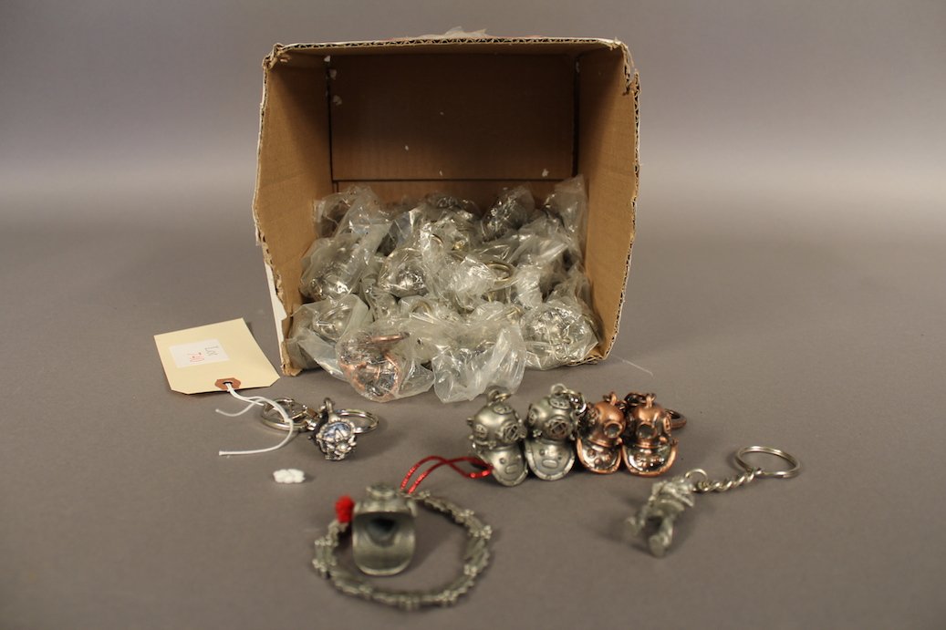 44 Deep Sea Diving Keychains: Lot of 44 diving theme keychains including 13 full bodied diver's and 31 helmet style. Some of these are from the Morse Diving Co., Inc.