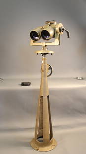 Precision binoculars on pedestal.: Set of scarce high precision binoculars of Russian manufacture With carry case. Mounted to a chest high pedestal with crank mechanism. 65” tall, lens cowls are 5 1/2” diameter.