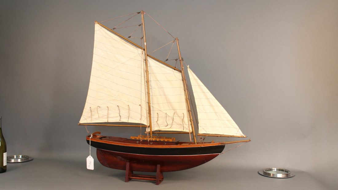 Two masted schooner model: Decorative model of a two-masted schooner with painted and varnished hull. Full suit of sails. 35 x 7 x 33