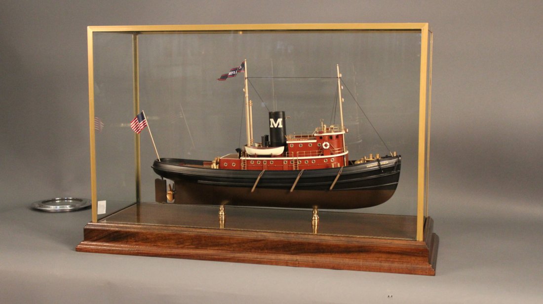 Ship Model New York Harbor Tug Boat: Display model of the New York Harbor Tug Boat, Edmond Moran. Tug model is complete with many brass fittings and details including lifeboats, spotlight, binnacle, winch, wheel, bumpers, ladder, stacks
