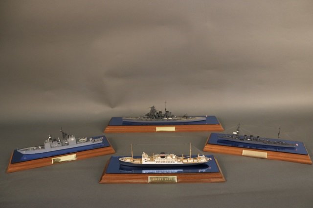Group of four waterline ship models: Group of four waterline ship models on blue mirrored bases from the workshop of the Iron Shipwright. Vessels included the Hikawa Maru, The USS Vincennes, The Ijn Kongo and the Ijn Kiso. Case dimension