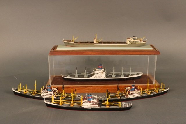 Five Waterline Ship Models from Christies: Five waterline ship models including the cargo ships President Madison, President Van Buren, and APL Freighter, and one carrier Gertrude Fritzen. Purchased at Christies in 1999. Dimensions: 7" to 12"