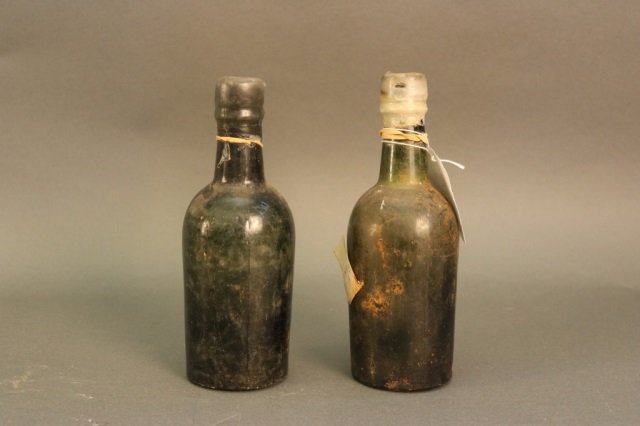 Pair of Beer Bottles from Shipwreck: Pair of salvaged beer bottles with canteen from the wreck of the RMS Republic. Dimensions: 9.5" H Weight: 6lbs