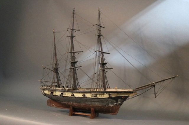 Primitive Model of an American Warship: Late 19th century model of an American warship. Fully rigged model with guns on deck. Dimensions: 36" L x 7" W x 28" H *This lot is part of a maritime antique auction of ship models, nautical relics,