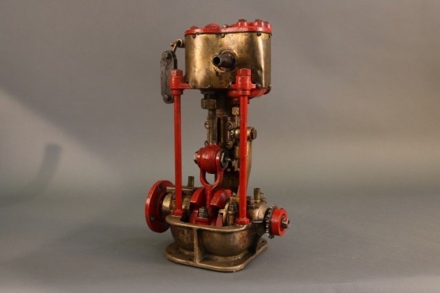 Steam Engine From a Small Vessel: Live steam engine of solid brass. Quite heavy. Dimensions: 11" L x 9" W x 18" H Weight: 51lbs *This lot is part of a maritime antique auction of ship models, nautical relics, marine paintings, boat pa