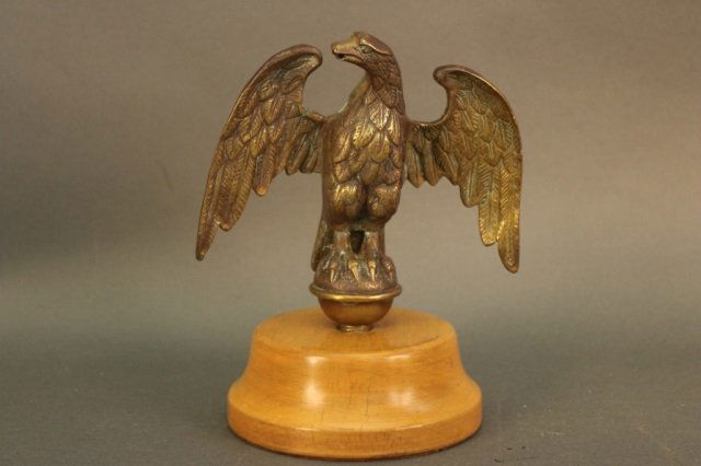Eagle: Eagle with stretched wings, mounted to wood base. Dimensions: 9" H x 5" W Weight: 4lbs *This lot is part of a maritime antique auction of ship models, nautical relics, marine paintings, boat parts, ya