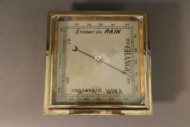 Brass Cased English Barometer: Highly polished English made library barometer. Glass window with pointer, engraved faceplate. Dimensions: 8.5" L x 8.5" H Weight: 4.5lbs *This lot is part of a maritime antique auction of ship models