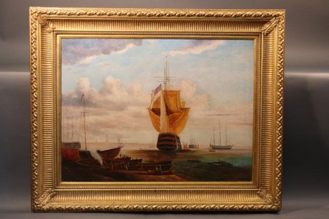 English Ship of the Line Painting: Stern view of an English warship flying the flag. Other ships are seen at anchor and a crowd is at the shore. Mounted into a substantial wood frame. Signed in lower left hand corner "R. Roberts" in re