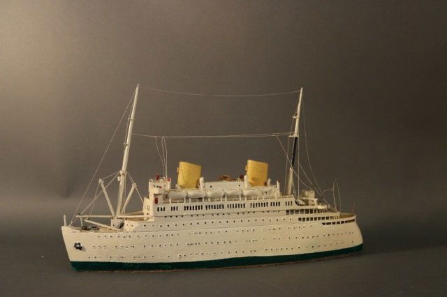 Model of South American Cruise Ship: Waterline model of a two stack ocean liner. Hull is painted off white above the waterline. Dimensions: 24" L x 4" W x 13" H Weight: 3lbs *This lot is part of a maritime antique auction of ship models,