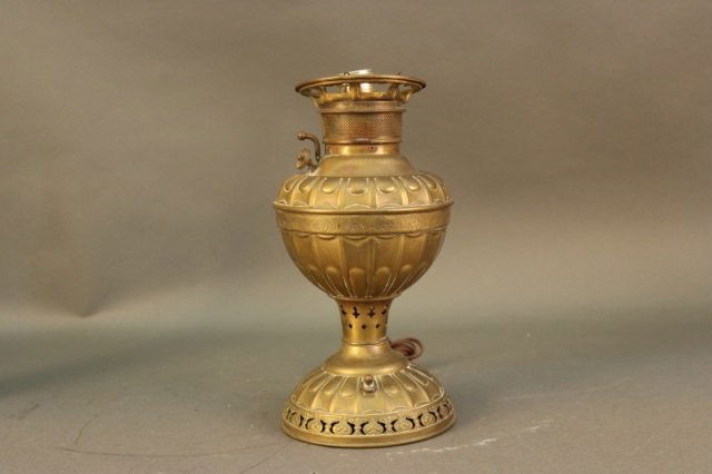 Early Brass Oil Lamp: Early brass oil lamp, no globe. Embossed "The Emperors No. 2" Made in the USA. Dimensions: 13" H x 6" W Weight: 3lbs *This lot is part of a maritime antique auction of ship models, nautical relics, ma