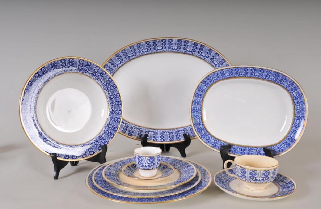 Partial Set of Minton "Kings Lily" Dinnerware: 64 pieces including: Eleven 10 1/4" plates; twelve 7 3/4" plates; five 9" plates; one 7 3/4" soup bowl; six 9 1/2" soup bowls; ten 6 1/2" saucers; two 5 1/2" saucers; one cup; nine demitasse cups; fiv