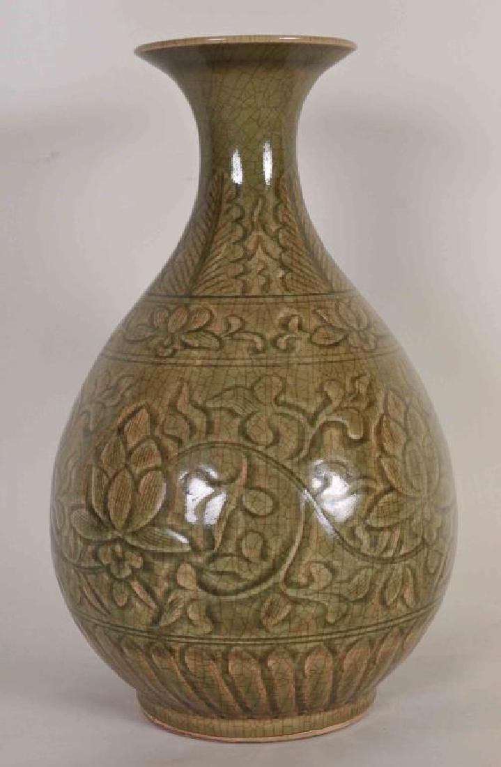 Chinese Yaozhou Ware Vase: Globular vase with flared rim; carved underglaze pattern of flowers, foliage and scrolling vines; olive green crackle glaze; 13 1/2"H; good condition (Ref. 3)