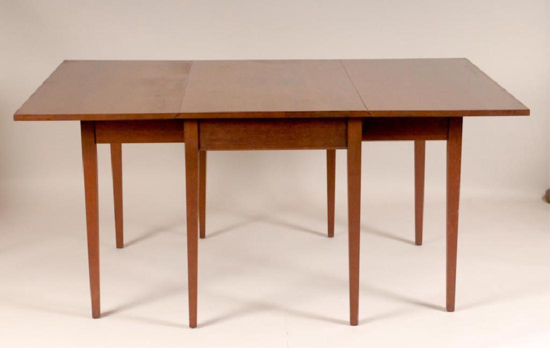 Craftique Hepplewhite Style Dining Table: Mahogany Hepplewhite style drop-leaf dining table with table pads, tapered legs, each drop leaf supported by two swing legs, Craftique label, mid 20th century; 26" x 42" opening to 66 1/2" x 42", 30"H