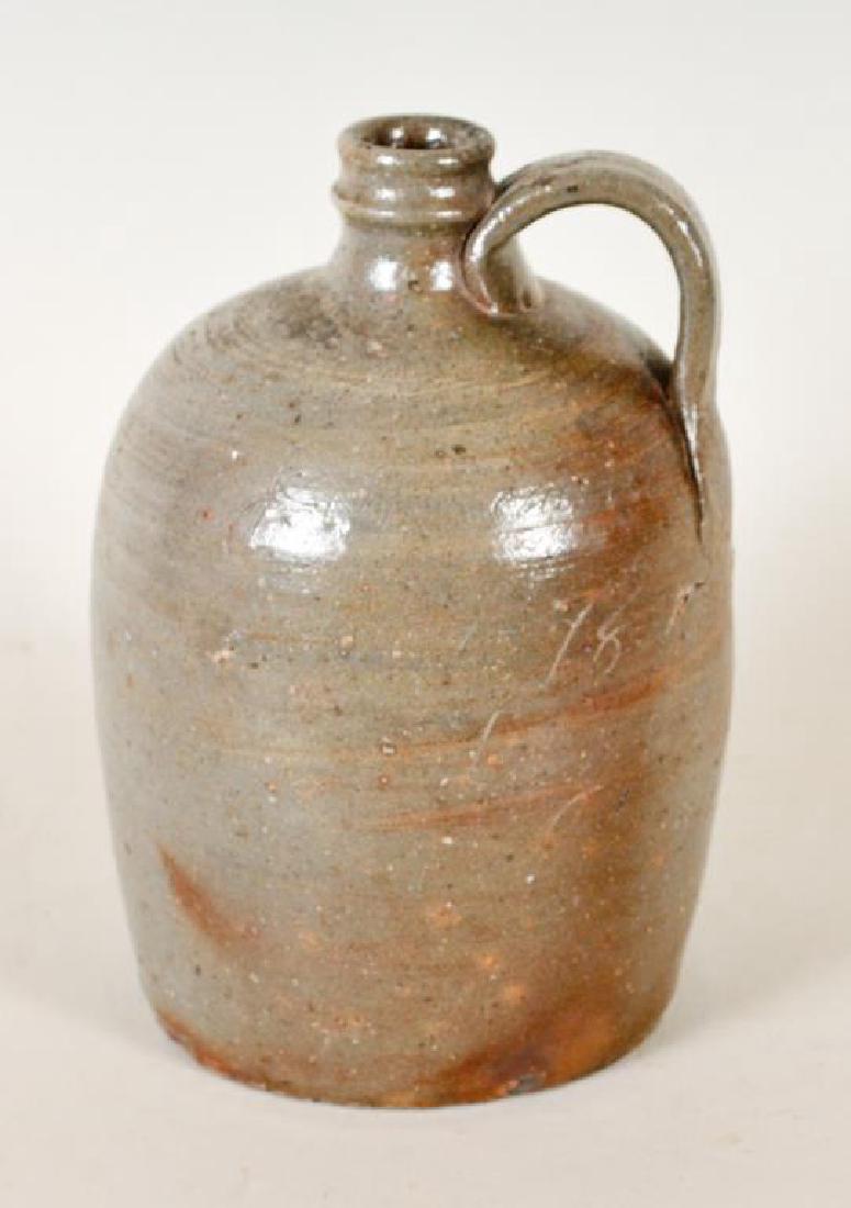 Rare Signed & Dated J. W. Teague NC Stoneware Jug: John Wesley Teague (North Carolina, 1867-1916), stoneware jug with strap handle, front inscribed "J. W. Teague / Sept 1896 / Lacey Leaf / NC; 8 3/4"H; crack at base of handle running between the numer