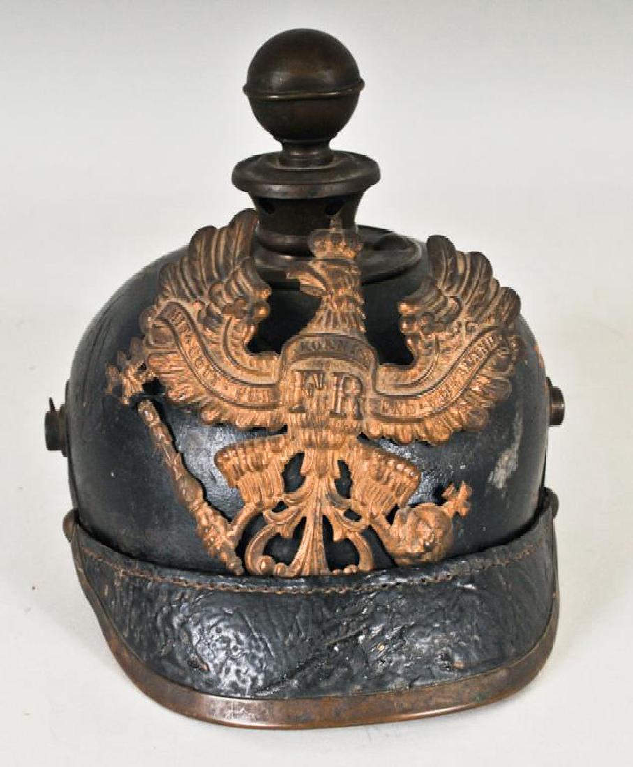 German Leather Pickelhaube Ball Spike Helmet: WWI or earlier, metal "FR" crowned eagle front plate, metal rim at visor, brass spine missing on back with subsequent small hole, no chin strap, front plate loose, leather with a few abrasions and scr