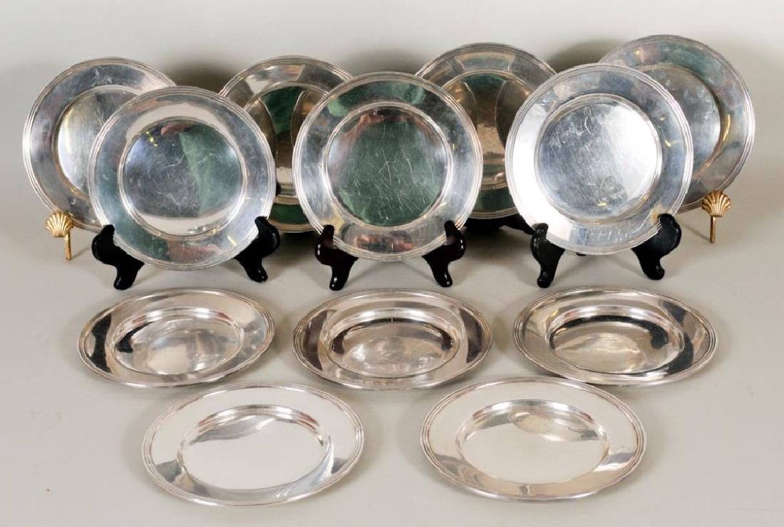 Set of 12 Sterling Silver Bread & Butter Plates: National Silver Co., no monogram; 6" dia.; general marks, bumps, and surface scratches throughout consistent with age and use, a few with a deeper scratch; total weight 23.2 ozt (Ref. 2-1)
