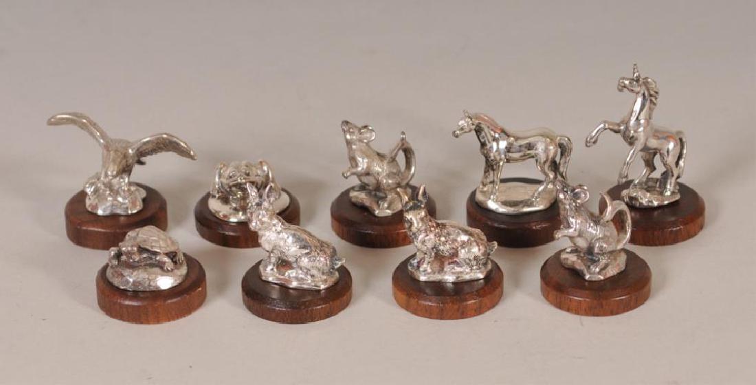 9 Kirk Stieff Sterling Miniature Animal Figures: Nine sterling silver animal sculptures, each mounted on a round walnut base, including: (1) spread-wing bald eagle, (1) frog, (2) rabbits, (2) mice, (1) horse rearing on hind legs, (1) horse standing,
