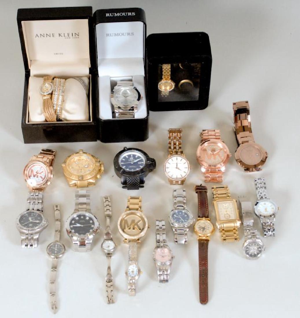 Large Lot of Designer Watches: 22 watching including: Three Anne Klein, two with diamonds and one of these in original box---Two Invicta (neither with bands, one with broken crystal)---Three Rumours (two ladies, one man, man in ori