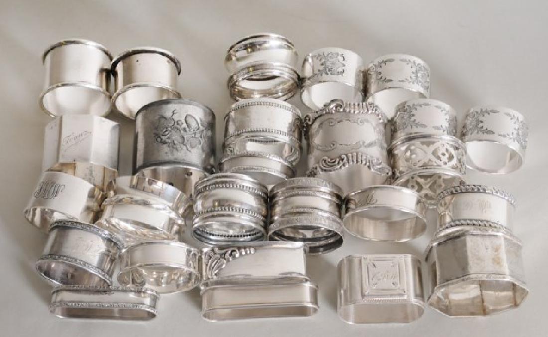 Lot of 26 Sterling and Silverplate Napkin Rings: 13 marked for sterling and 13 unmarked----Marked sterling includes: Gorham round elongated 6290/1, no monogram---Gorham circular 6290, engraved with initial "W" or "M"---Circular with beaded trim and 