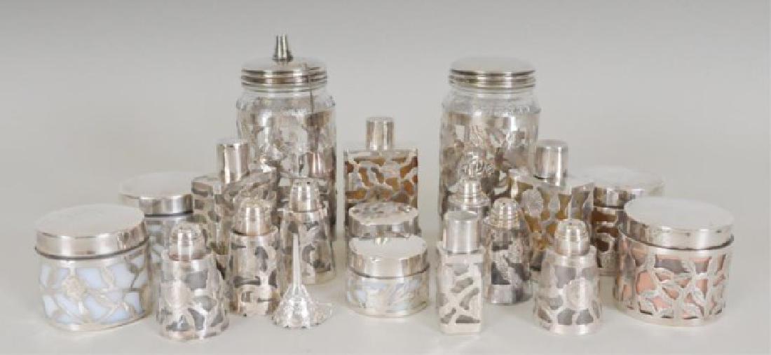 Sterling Perfume Funnel & Sterling Overlay Items: 19 total items; all marked "Hecho En Mexico 925", "Mexico 925", or "Taxco 925"; some with maker's marks: 1. 1 3/4"L perfume funnel with scalloped rim---2. Pair of glass jars embossed "Nestle" with ste