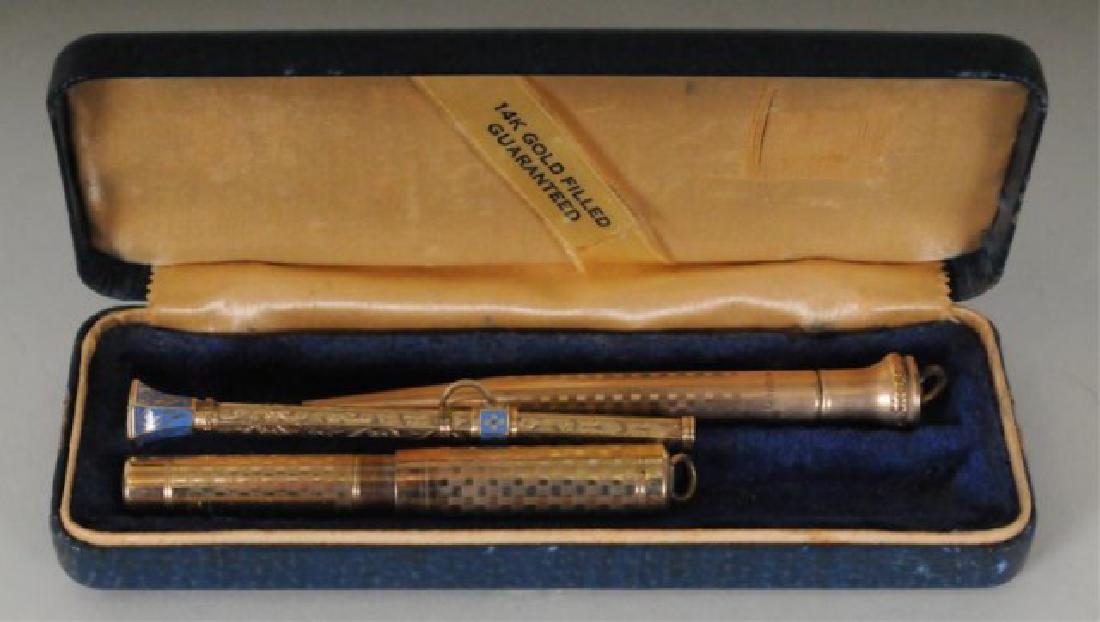 Pen / Pencil Pendant Set & Telescoping Pencil: Lot includes three writing instruments: 1. 14kt gold filled pendant fountain pen and pencil set, each with ring on top for suspending, decorated with linear checkered tooling, fountain pen with 14kt n