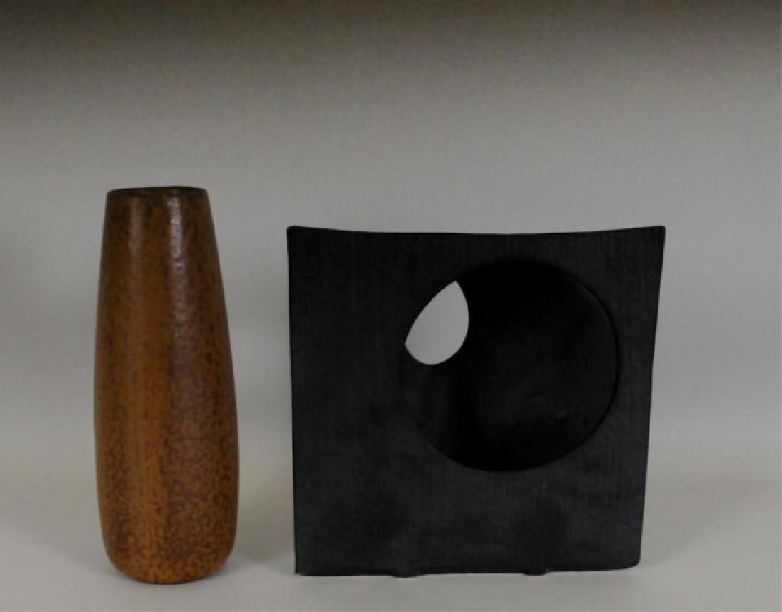 2 Japanese Ikebana Pottery Vases, One Signed: Two mid century Japanese ikebana vases: 1. Tapered cylindrical vase, brown mottled glaze, signed on base; 9 1/2"H; good condition---2. Square form vase, rounded on one side with oval opening, flat on 