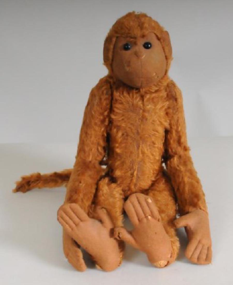 Unusual Jointed Monkey, Probably Steiff: Felt face and ears with shoe button eyes, center seam stitching; articulated at neck, shoulders and hips; felt hands and feet with individual stitched digits, 16"H; insect damage with three small hole