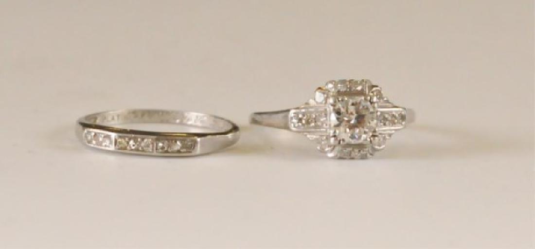 Platinum and Diamond Wedding Set: Engagement ring centers one transitional cut very clean diamond with good color, estimated 1/2 carat, accented with 14 single cut 1mm round diamonds; wedding ring accented with 9 single cut 1mm diamon